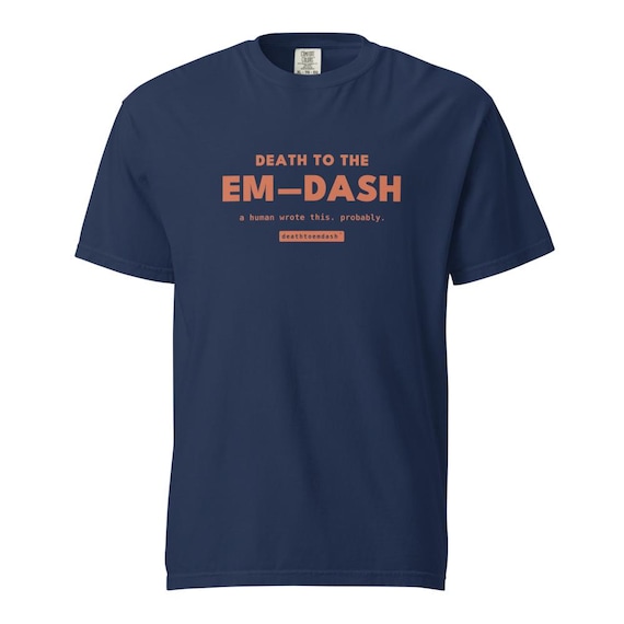 death to the em dash tee, shown flat so the design reads