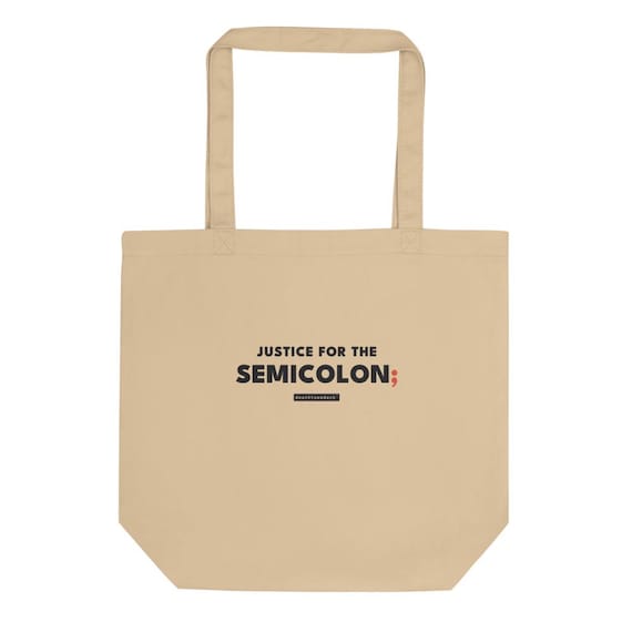 justice for the semicolon tee, shown flat so the design reads
