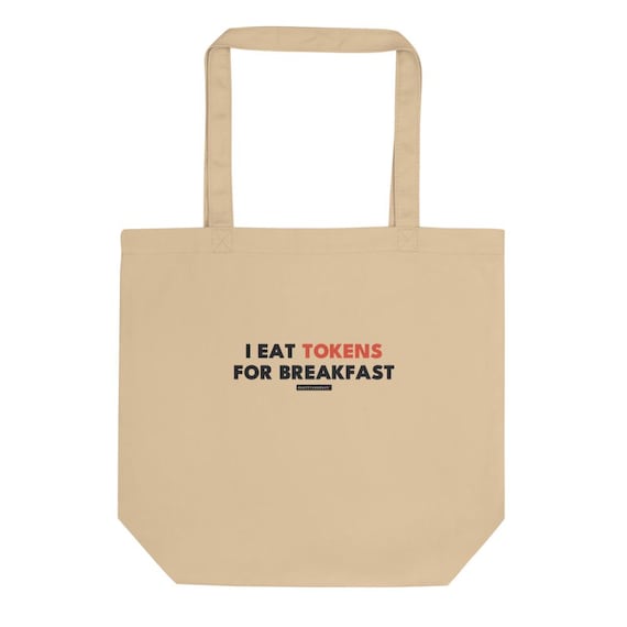 i eat tokens for breakfast tee, shown flat so the design reads