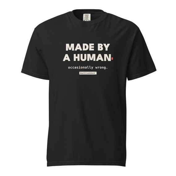 made by a human occasionally wrong tee, shown flat so the design reads