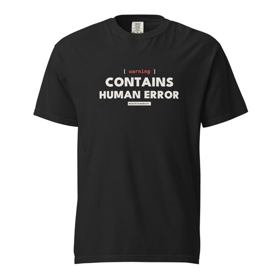 warning contains human error tee, shown flat so the design reads