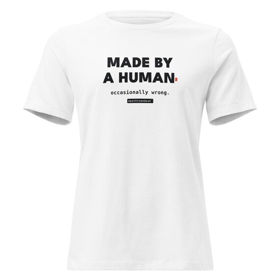 made by a human occasionally wrong tee, shown flat so the design reads