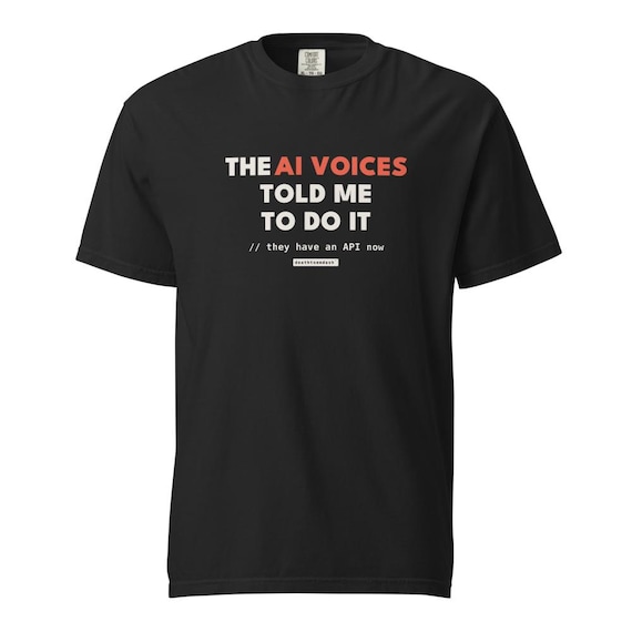 ai voices told me tee, shown flat so the design reads