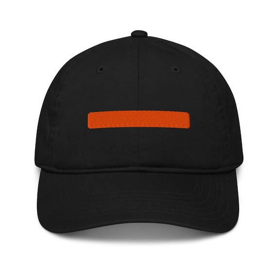 Black cap with the coral em-dash bar embroidered on the front