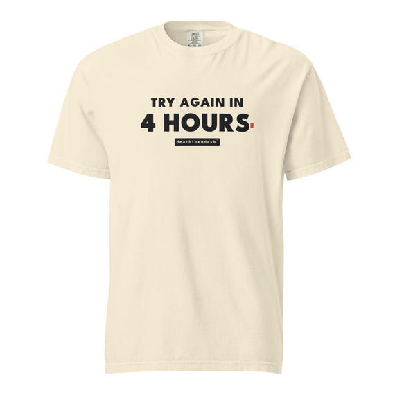 try again in 4 hours tee, shown flat so the design reads